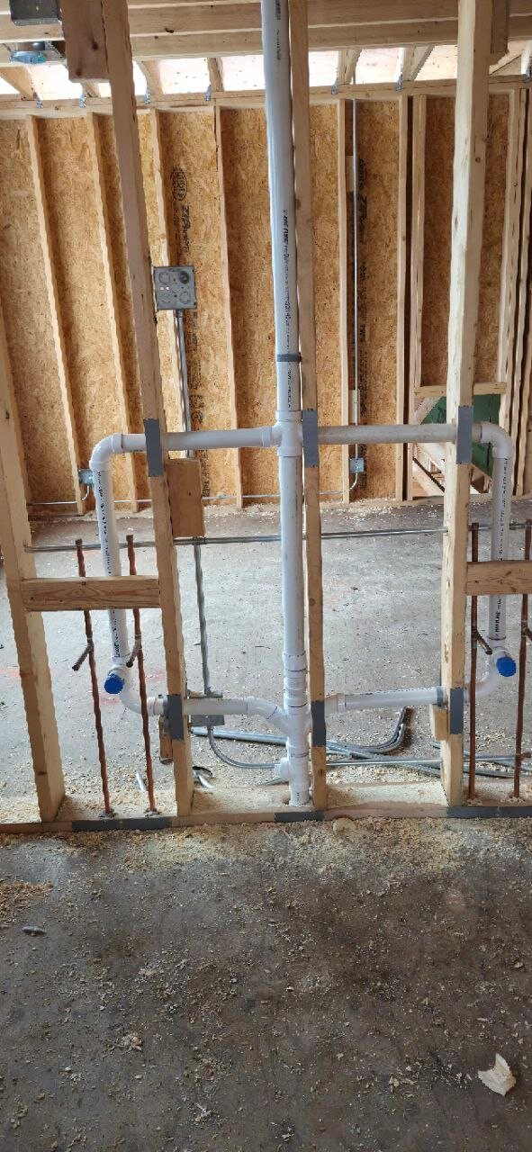 Utility room sink with copper and PVC plumbing connections
