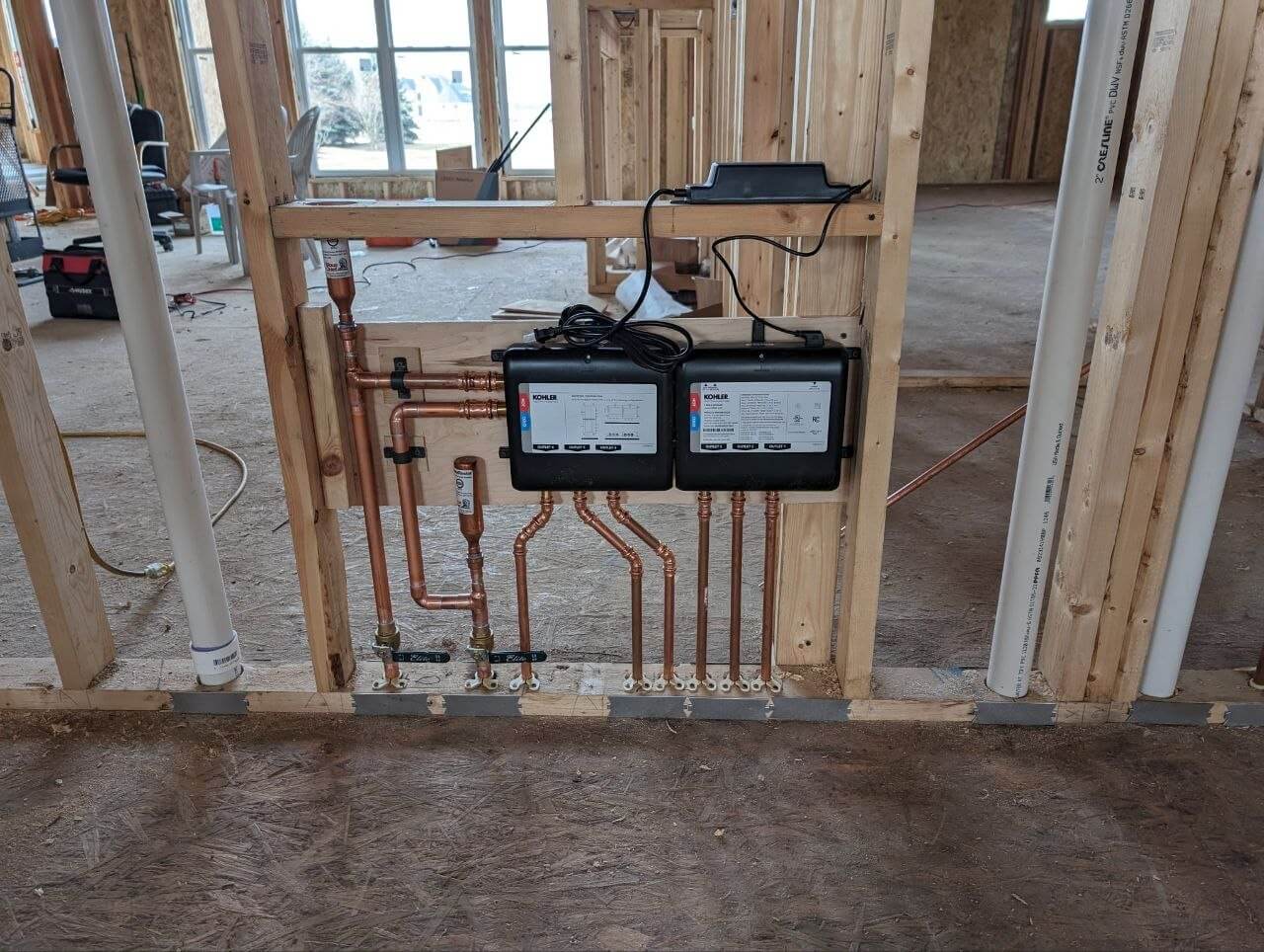 PEX manifold system installed during new construction framing