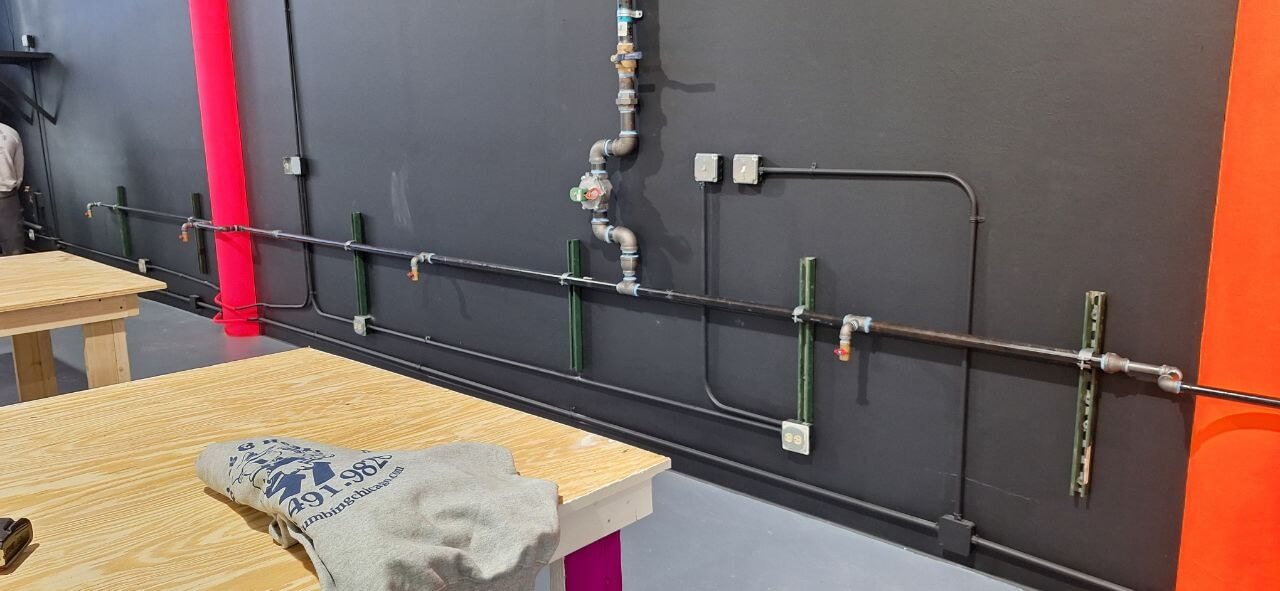 New plumbing rough-in with copper and PVC lines during new home construction