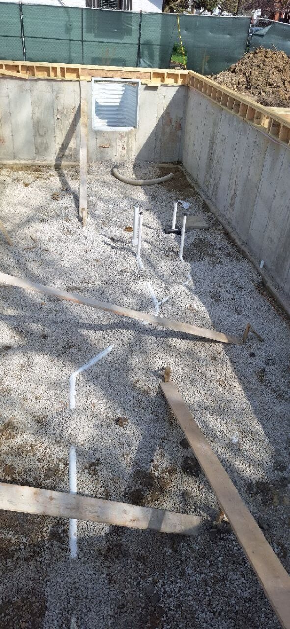 Underground plumbing vent pipes in a new construction foundation